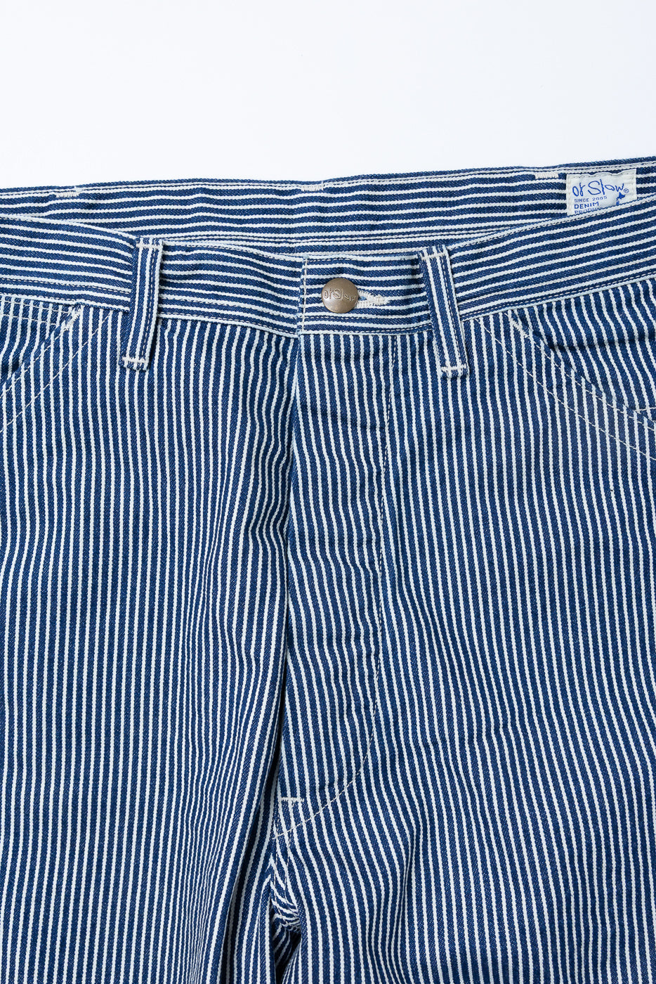 Close-up front view of hickory stripe painter pants, showing waistband, button, and pockets.