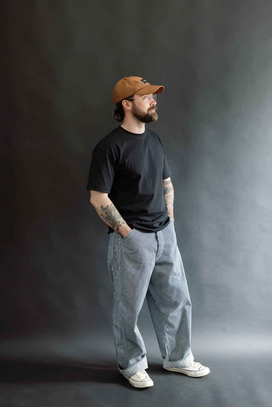 Full body front left view of male model 5'9