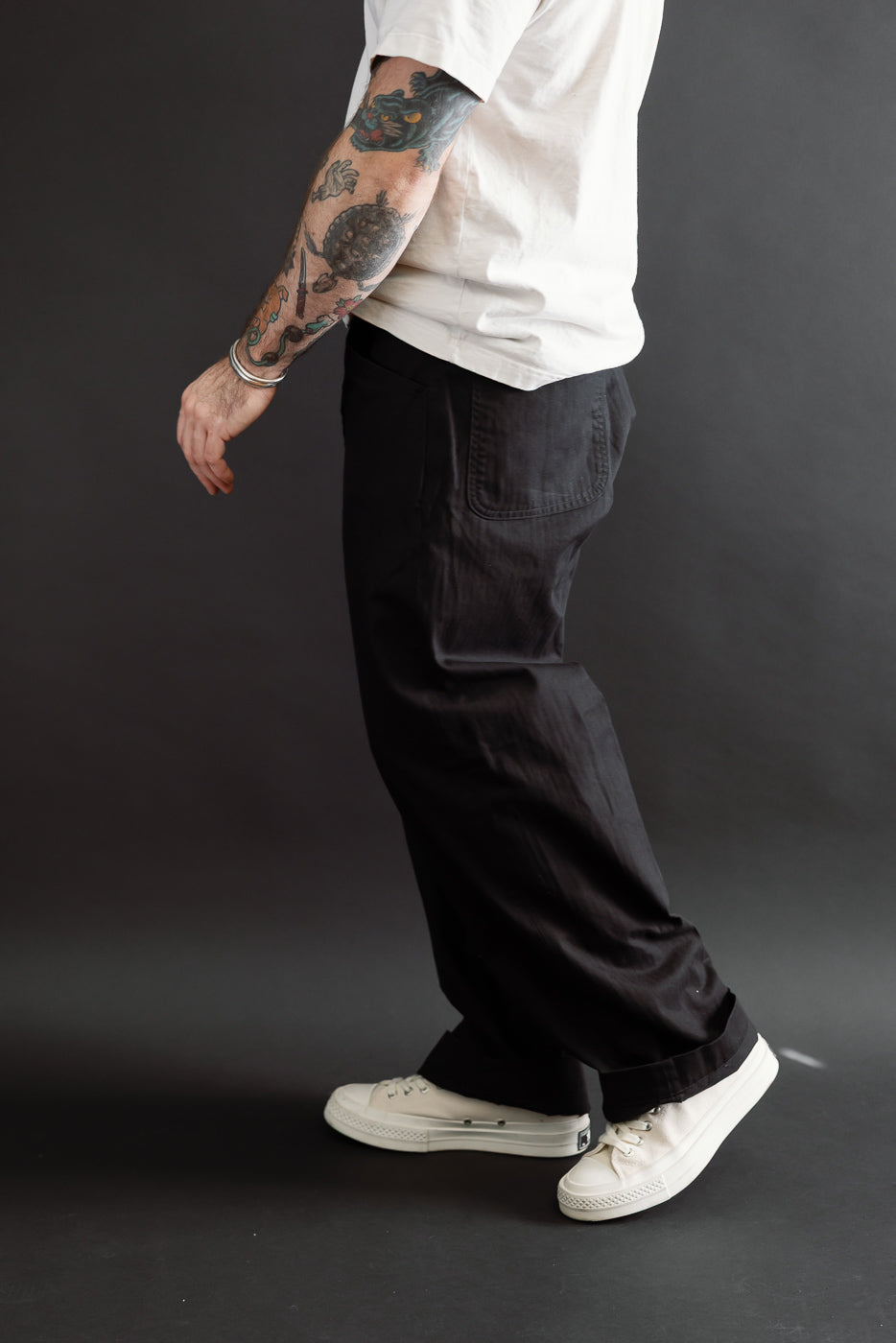 Full body side view of a male model, 5'9