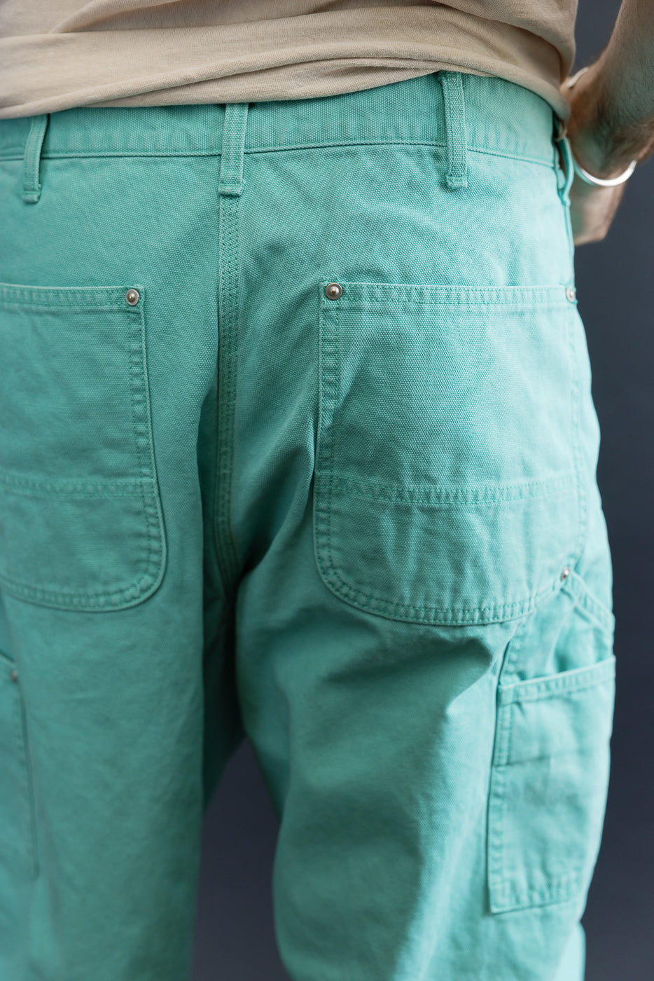 Close-up of the 01-5328-39SK - Dad's Fit Painter's Pants Canvas in Turquoise, showcasing large patch pockets and brass rivets, emphasizing the workwear style and quality craftsmanship.