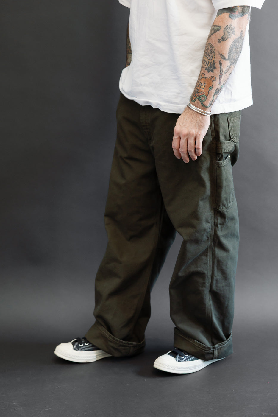 Full body side view of a male model, 5'9