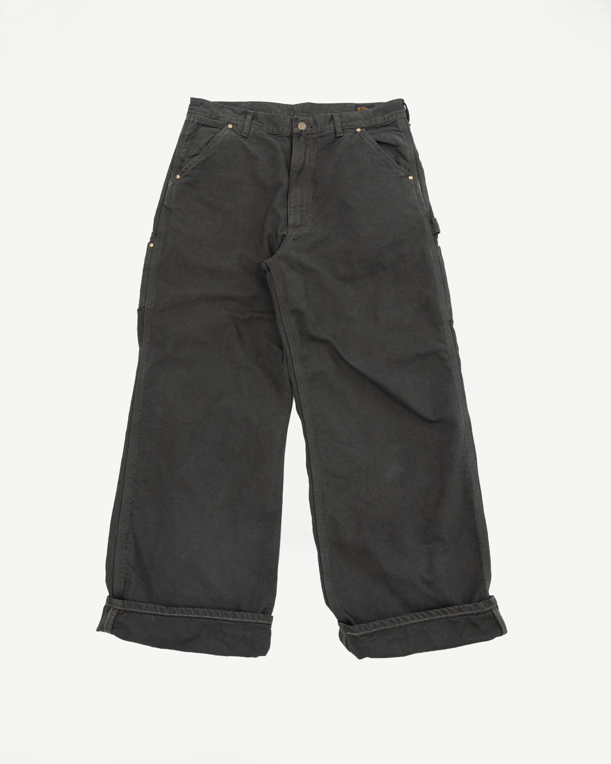 Front view flat lay of black wide-leg canvas work pants with cuffed hems.