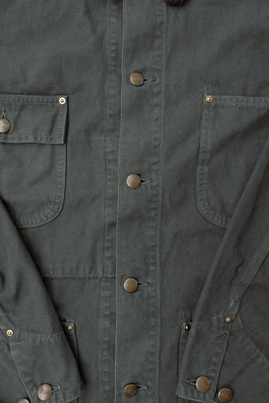 Close-up of orSlow army green relaxed fit coverall jacket front, metal buttons, chest pockets