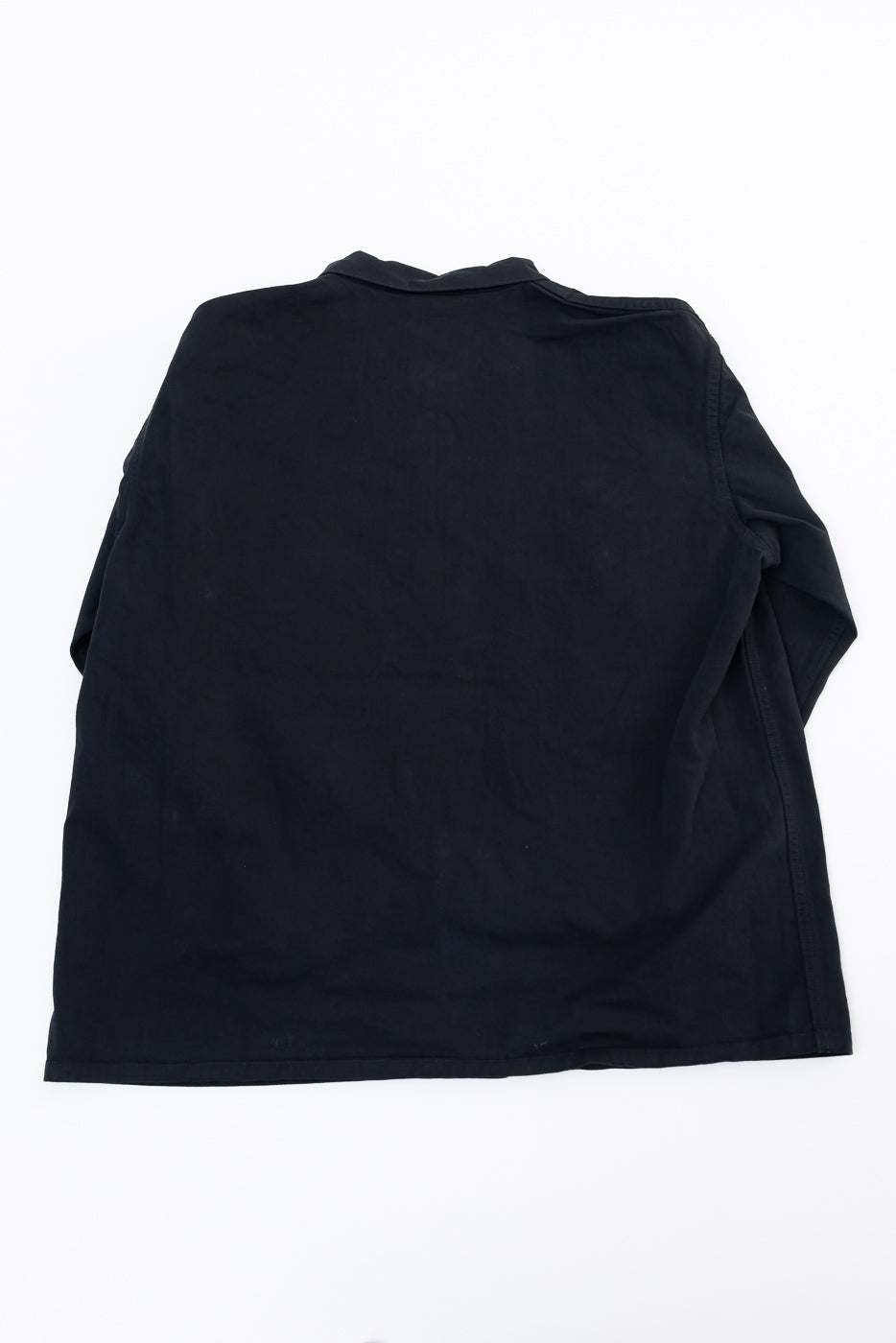 Back view flat lay of a black long-sleeve polo shirt.