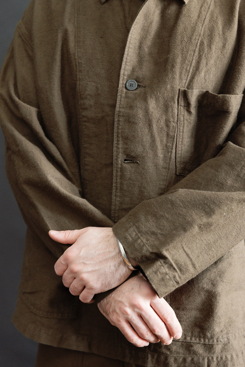 Close-up front of Orslow moleskin work jacket in coffee brown on male model, 5'9
