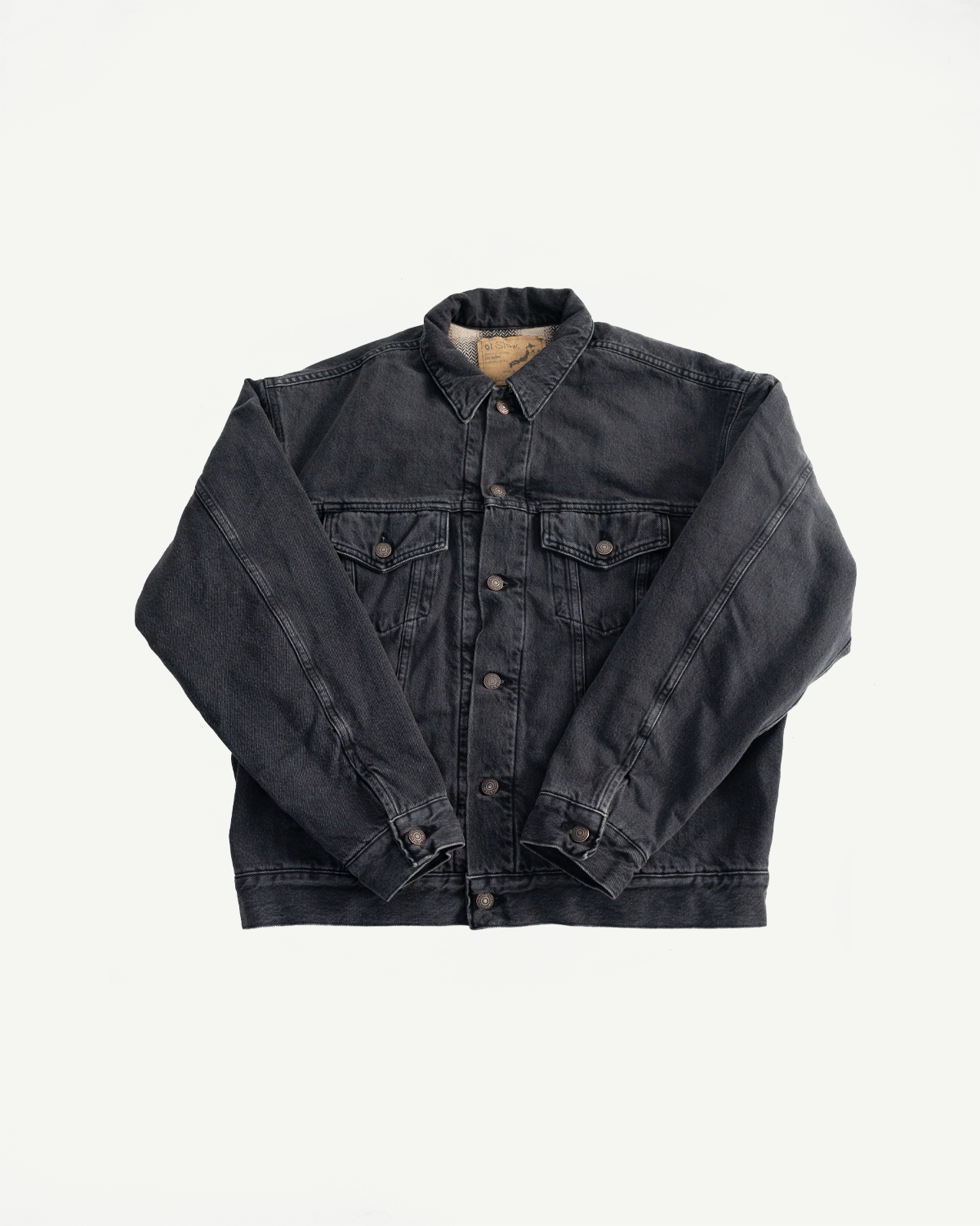 Front flat lay of black denim Type 3 jacket, button details, pointed collar, chest pockets.