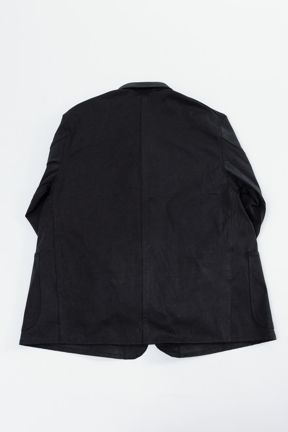 Back view of a black casual blazer shown in a flat lay.