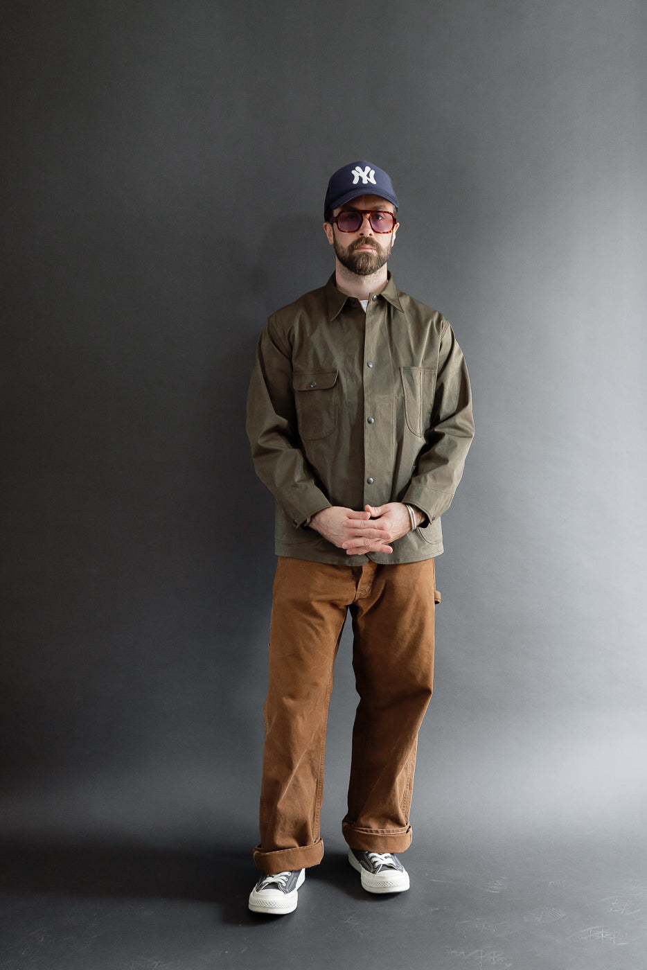 Full body front view of a male model, 5'9