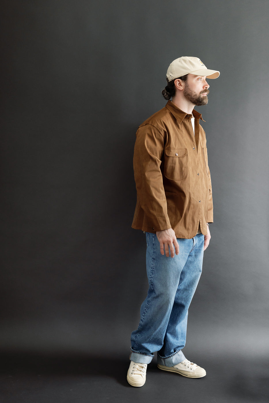 Full body side view of a male model, 5'9