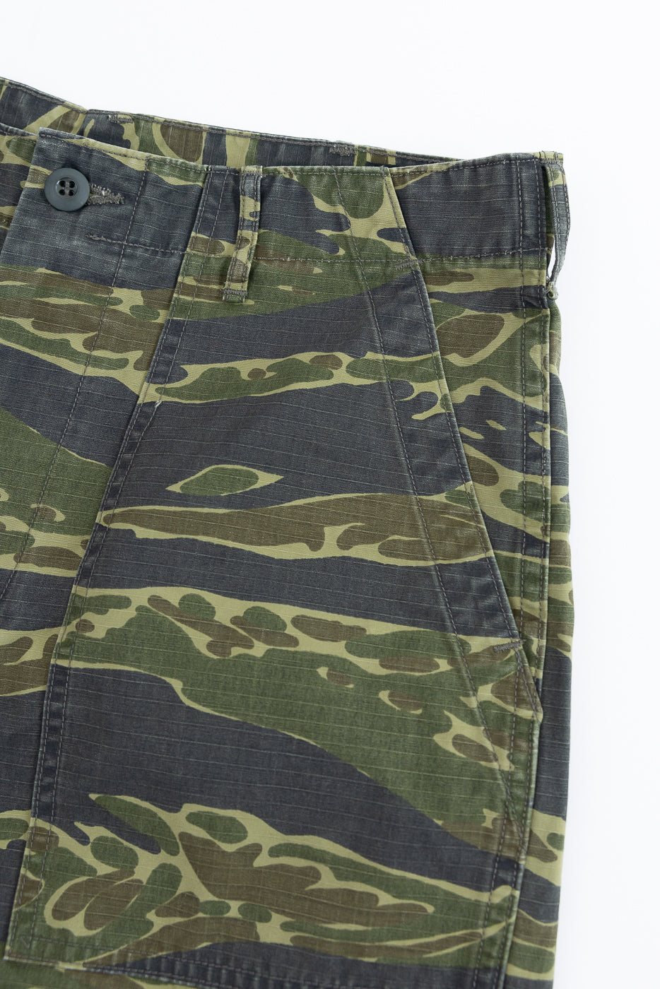 01-7002-TGC - Fatigue Shorts - Tiger Camo, featuring green-and-black tiger stripe camo fabric, button closure, belt loops, and slanted pocket, embodying orSlow's heritage-inspired design with a relaxed fit.