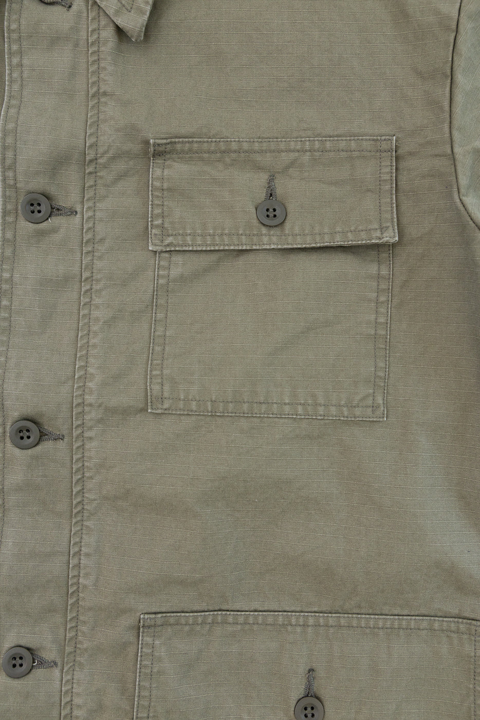 Close-up of the 01-8046-76k Utility Short Sleeve Work Shirt Jacket in Army Green, highlighting its button-front design, sturdy ripstop cotton, and functional utility pockets on the chest and body.