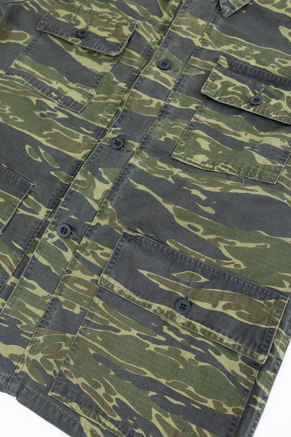 01-8046 -TGC - Utility Short Sleeve Work Shirt Jacket in Tiger Camo, showcasing its relaxed fit, button-front design, and functional chest and body pockets, crafted from durable cotton with a distinctive pattern.