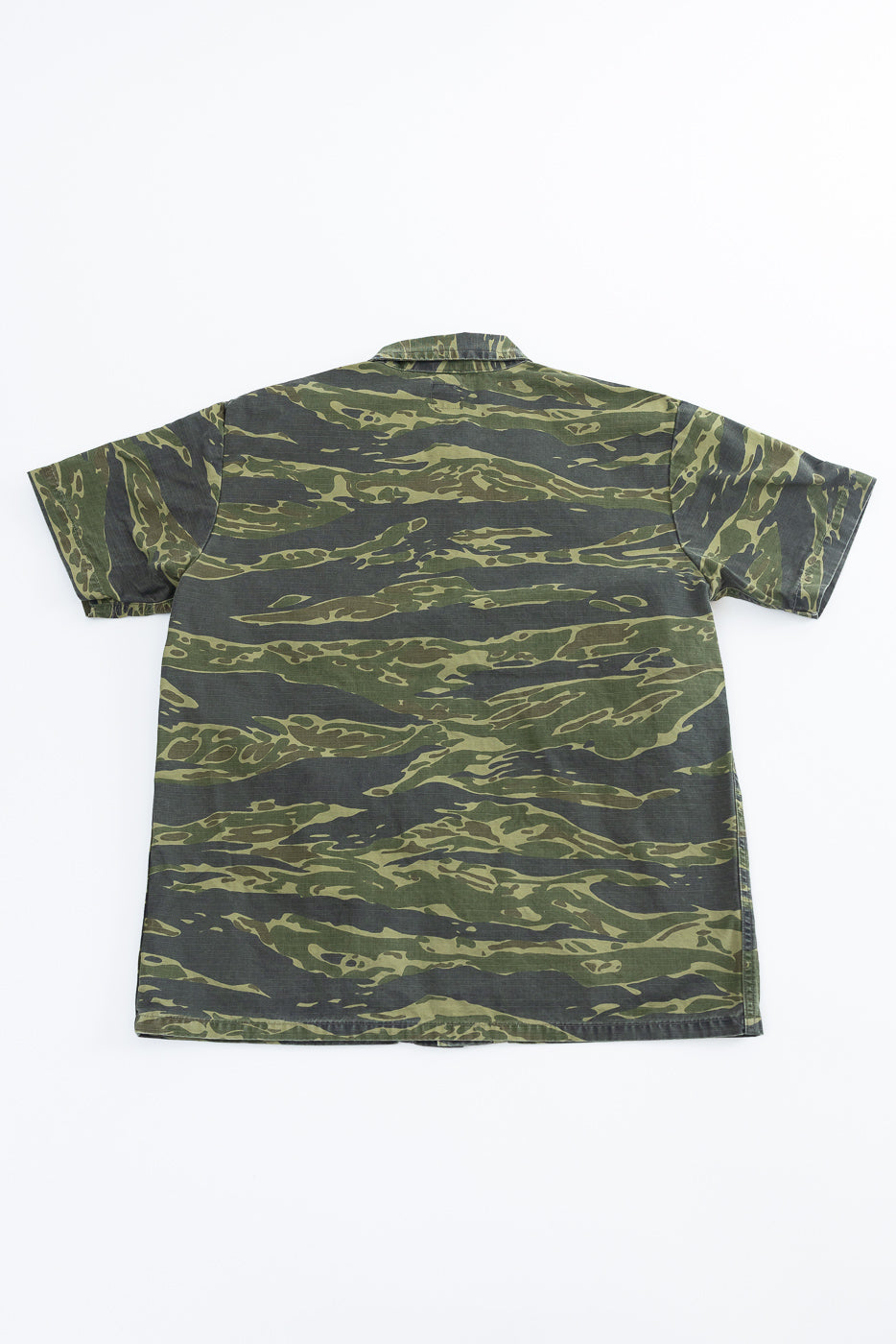 01-8046 -TGC - Utility Short Sleeve Work Shirt Jacket - Tiger Camo features a green and dark-olive tiger stripe pattern with a relaxed fit, camp-style collar, and utility pockets.