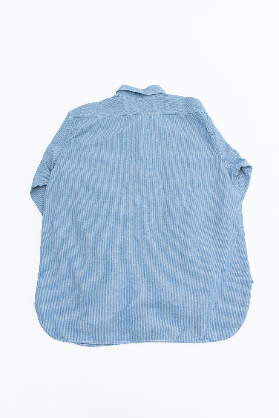 Back view of the 01-8270-181k - Relaxed Fit Chambray Work Shirt - Hickory, showcasing its light-blue fabric, button-up design, and classic workwear style.