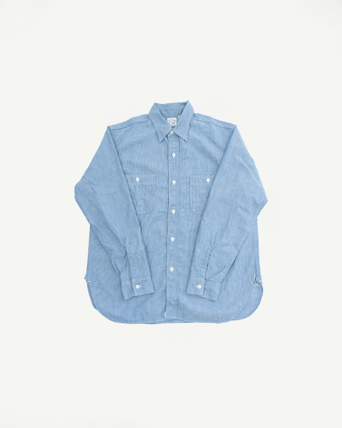 01-8270-181k Relaxed Fit Chambray Work Shirt - Hickory, featuring a pointed collar, white buttons, two chest pockets, and a hickory stripe pattern, highlighting American workwear and naval heritage.
