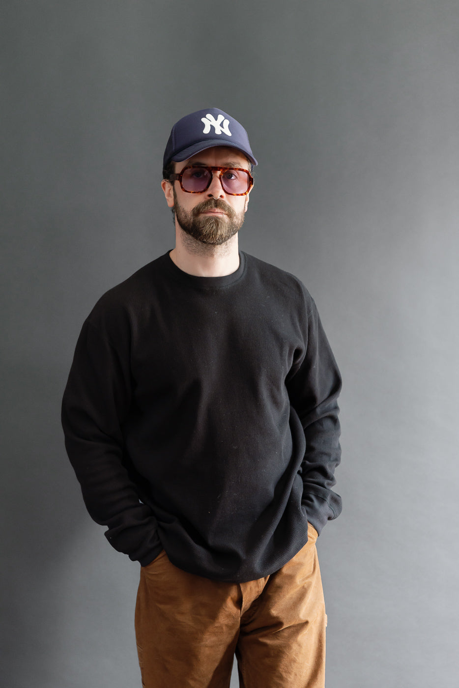 Full body front view of a male model, 5'9