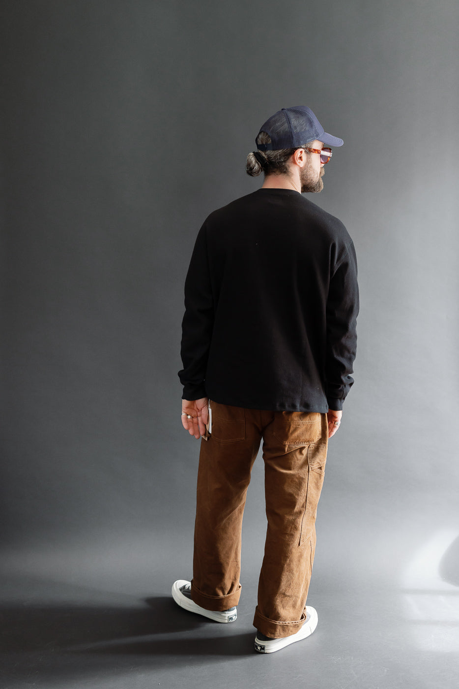Full body back view of a male model, 5'9
