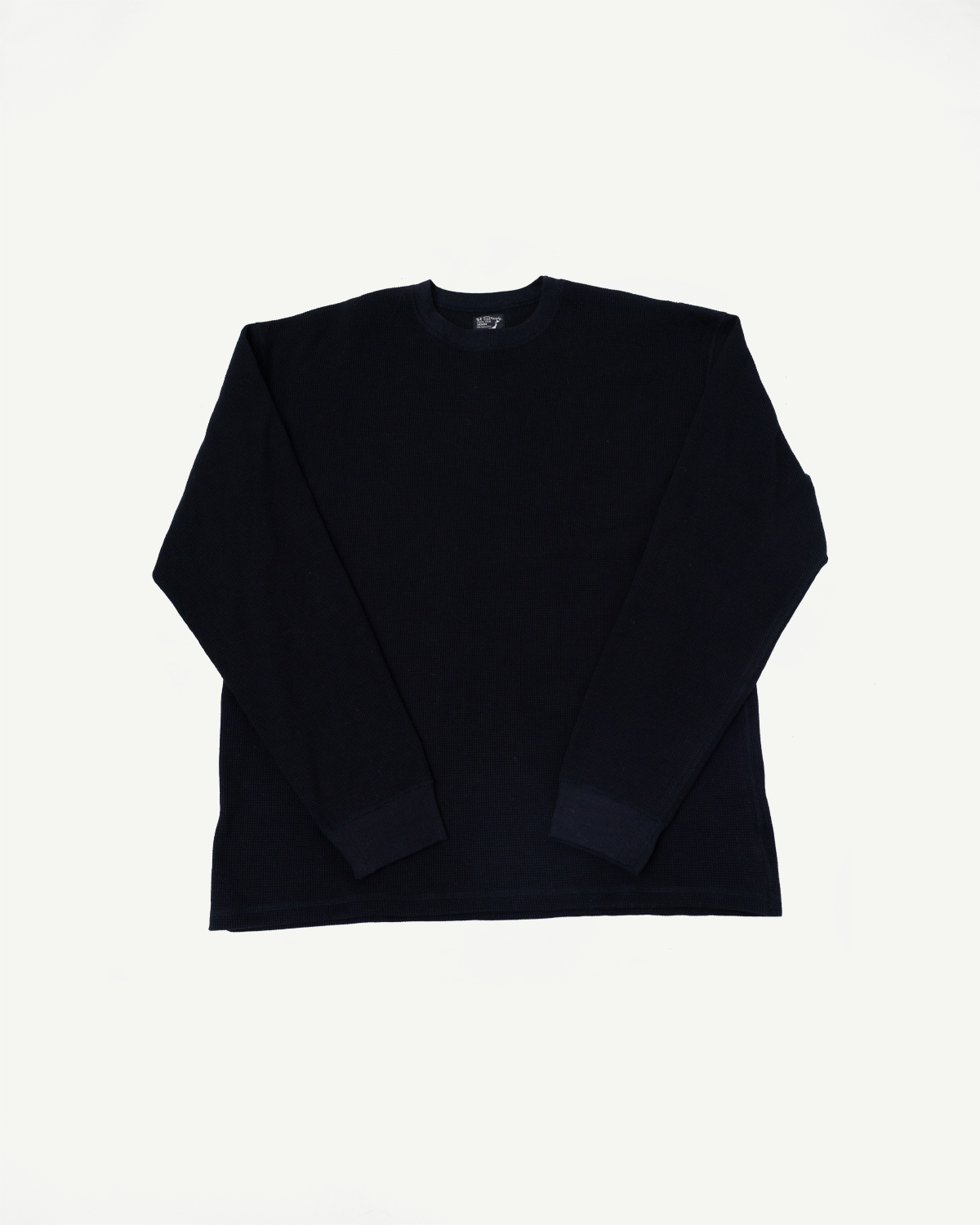 Front view flat lay of a black long-sleeve crewneck sweatshirt.