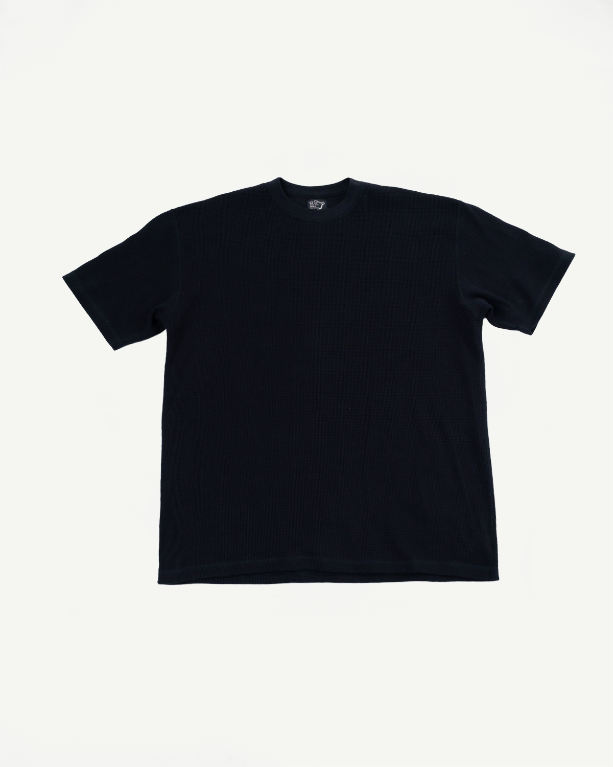 Front view flat lay of a black crew neck short sleeve t-shirt.