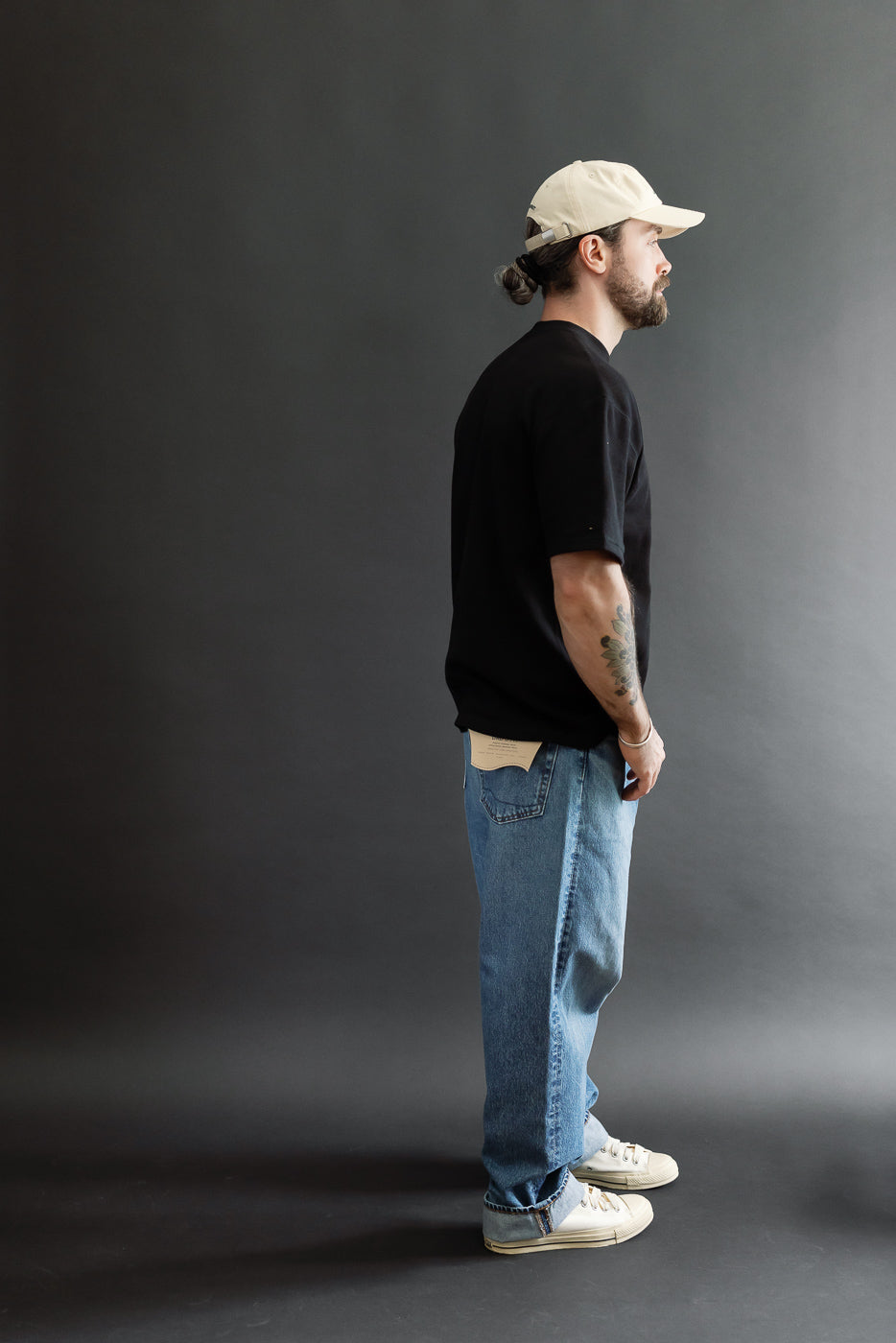 Full body side view of a male model, 5'9