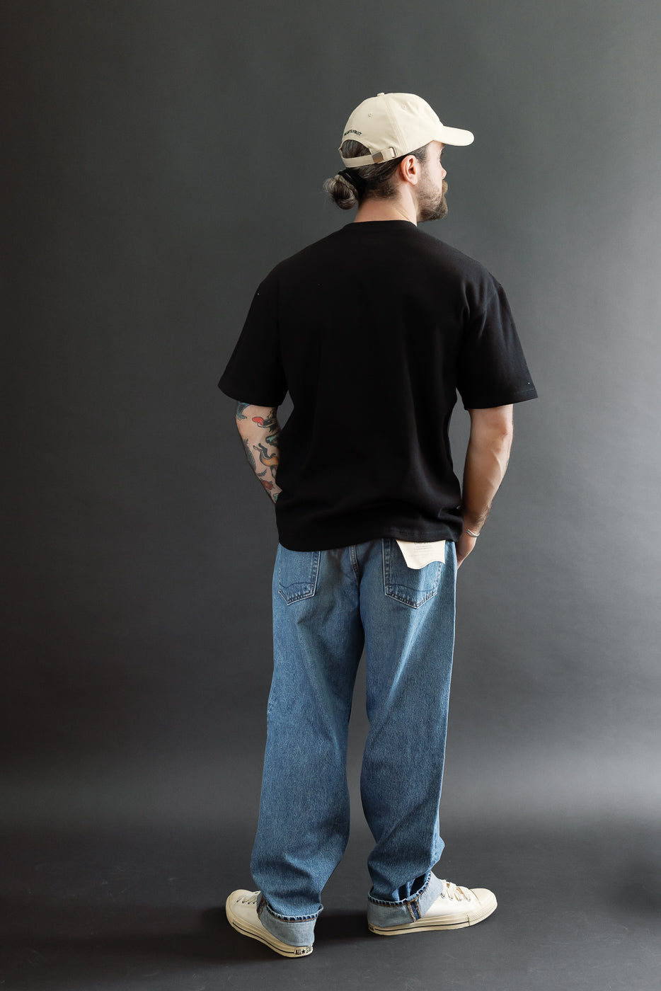 Full body back view of a male model (5'9