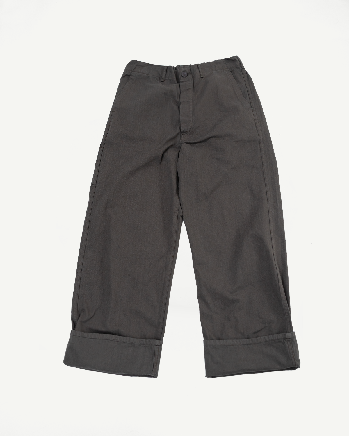 Front view flat lay of dark grey trousers with cuffed hems.