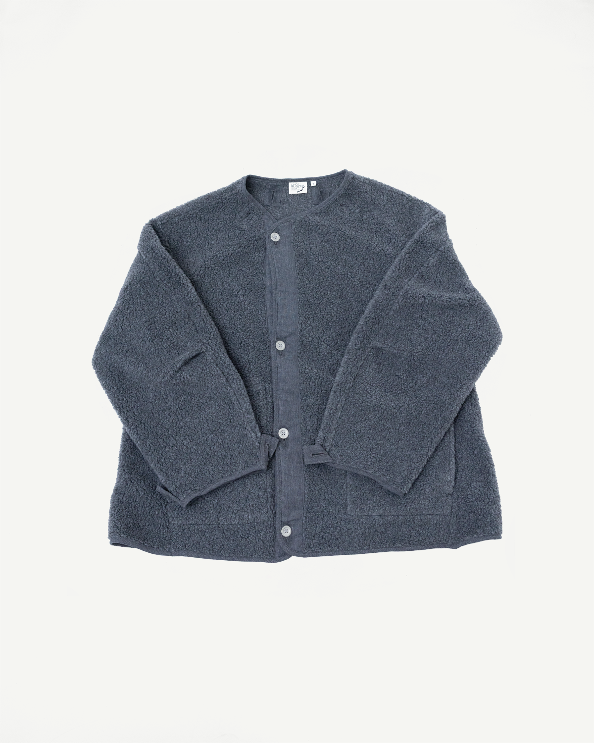 Front view flat lay of a charcoal grey textured fleece cardigan with buttons.