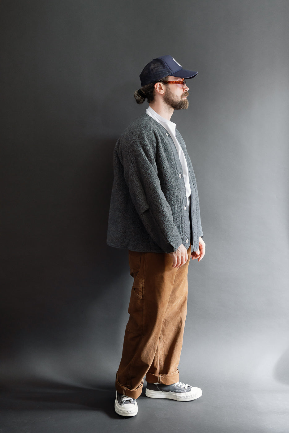 Full body side view of a male model, 5'9