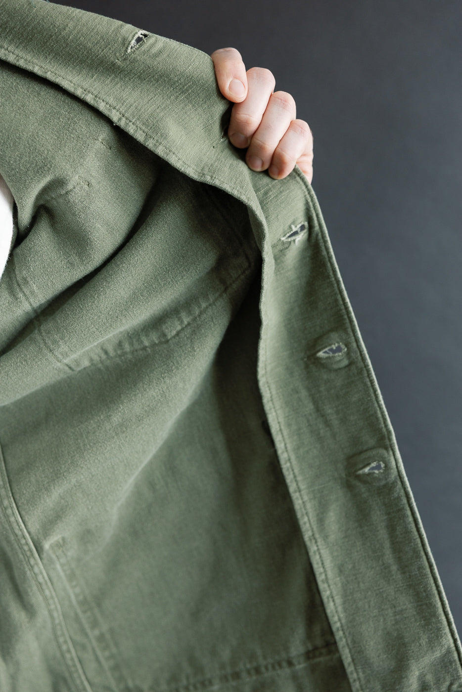Close-up of orSlow fatigue shirt inner fabric and buttonholes, reverse sateen, dark olive
