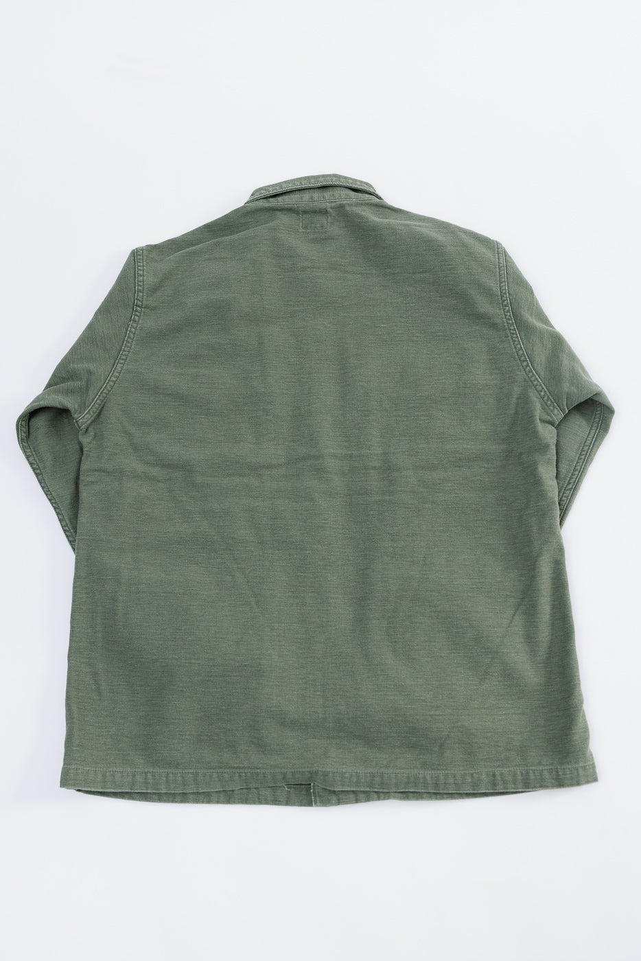 Back view flat lay of orSlow 4-pocket fatigue shirt in dark olive reverse sateen, showing fabric texture and straight hem.