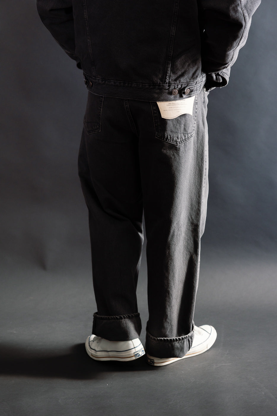 Back view close-up of orSlow Super Dads Fit black denim jeans on male model, 5'9