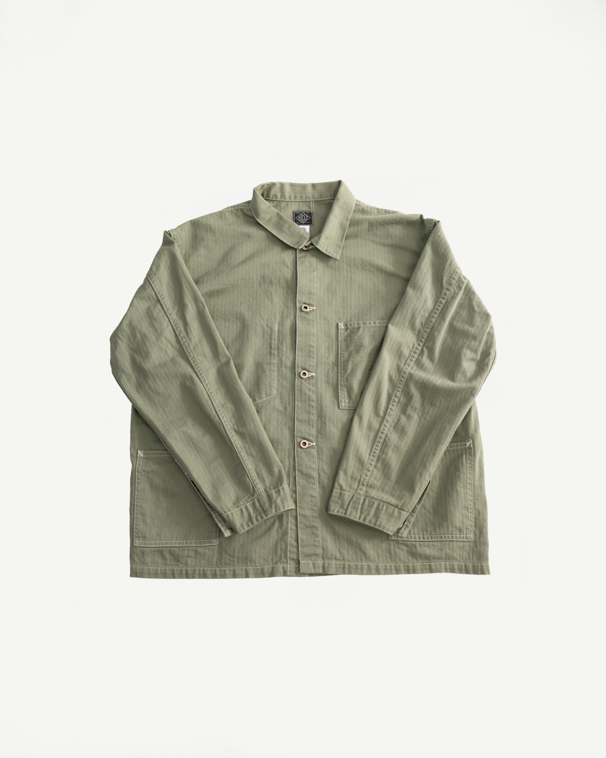Flat lay front view of sage green utility jacket with button closure, spread collar, and patch pockets.