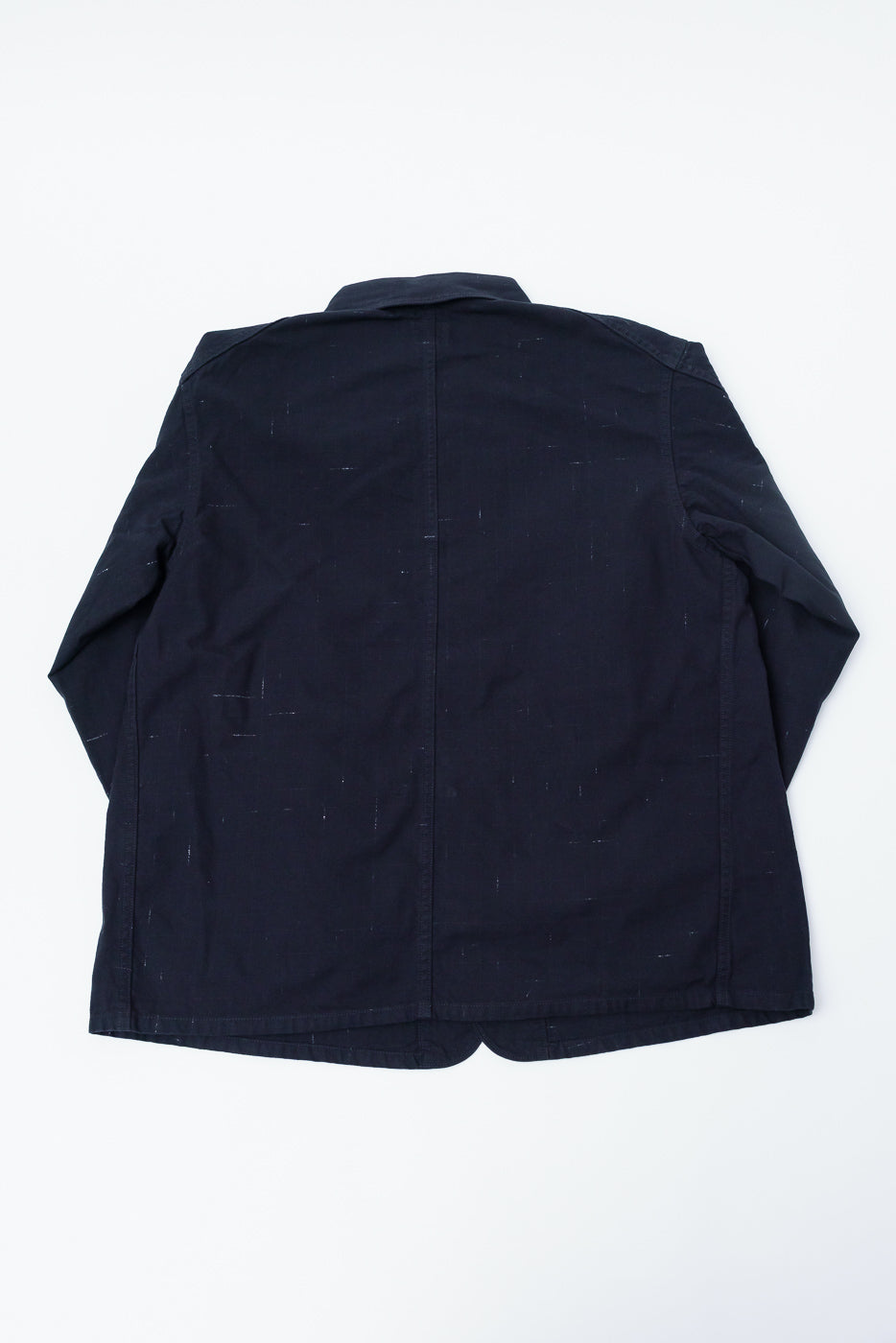 Flat lay of Post O'Alls black nep twill coverall, full back view, showing seam details.