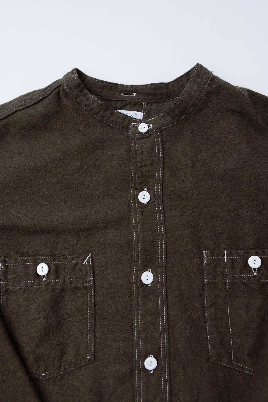 Close-up front view of Post O'Alls St Louis Band flannel shirt in tobacco, showing buttons, dual chest pockets, and band collar detail.