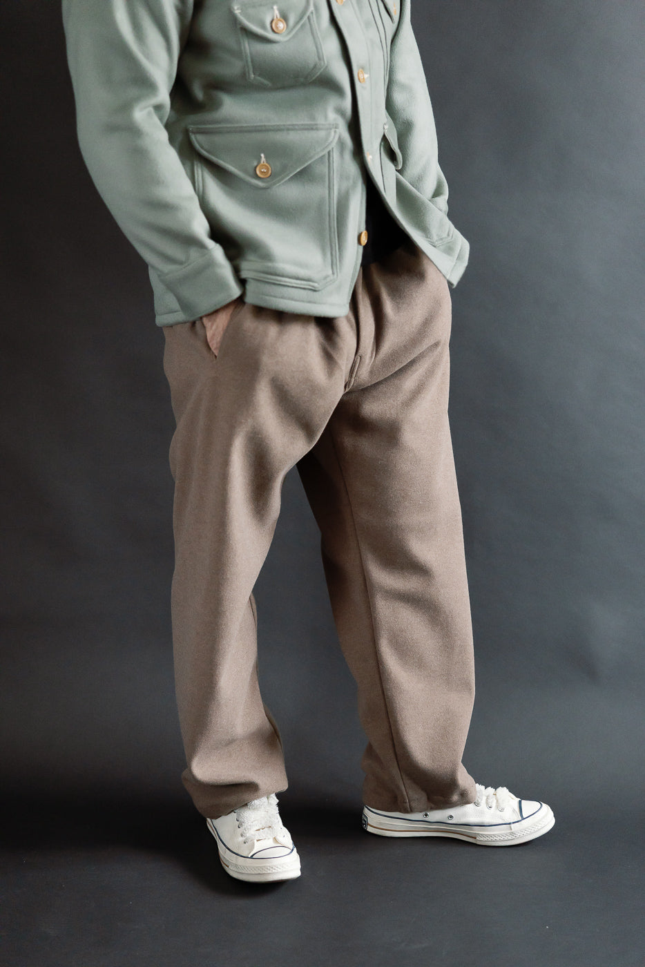 Front view, mid-length shot of brown sweat cloth pants on 5'9