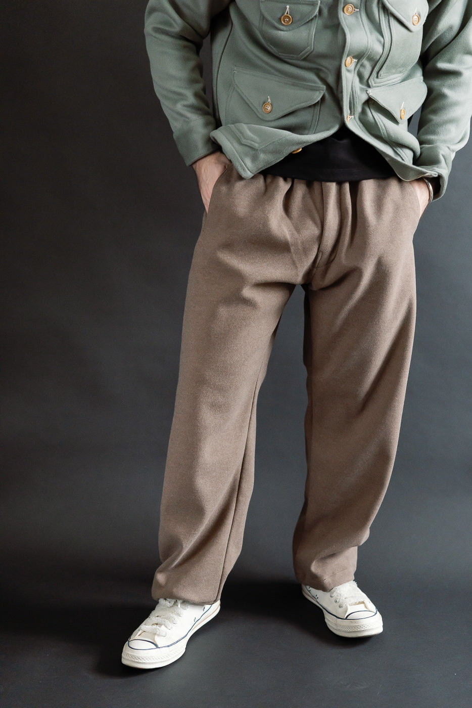 Front full body view of brown sweatpants on male model, 5'9