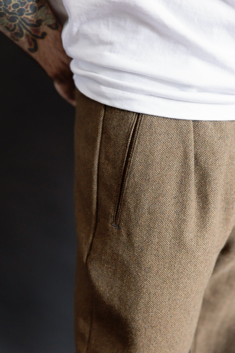 Close-up of brown basket tweed pants front side, male model 5'9