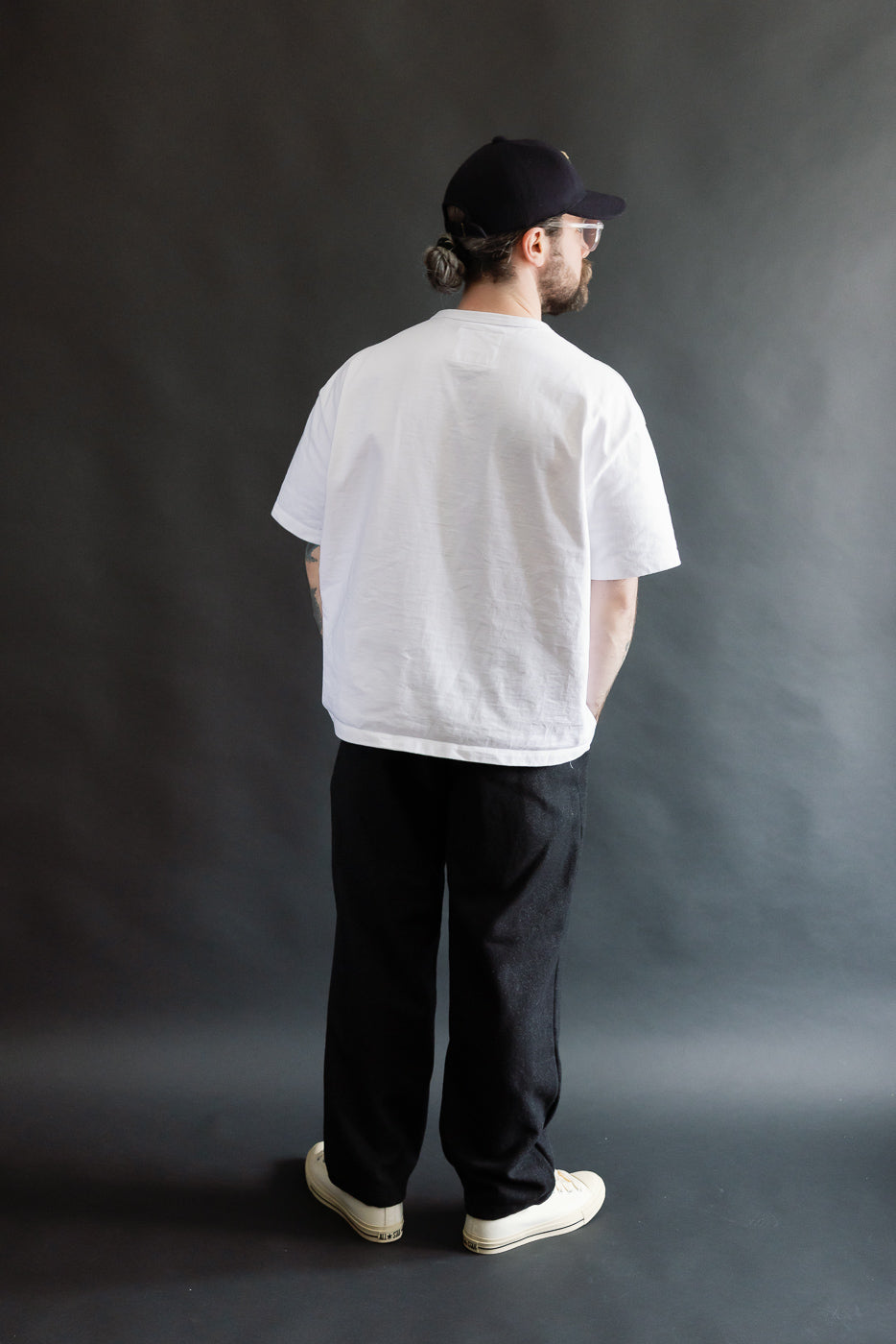 Full body rear view of male model 5'9