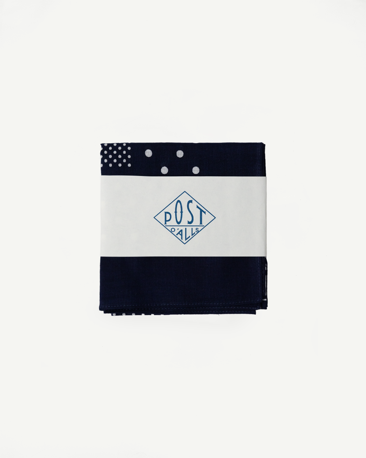 Front flat lay of navy bandana hankie with Post O’Alls branding, folded, polka dot detail visible