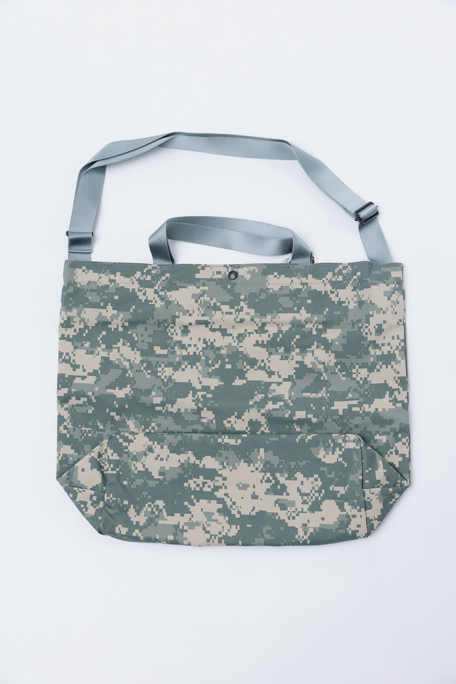 Front view flat lay of Post O'Alls New York Tote in Gore-Tex digital desert camo with grey straps