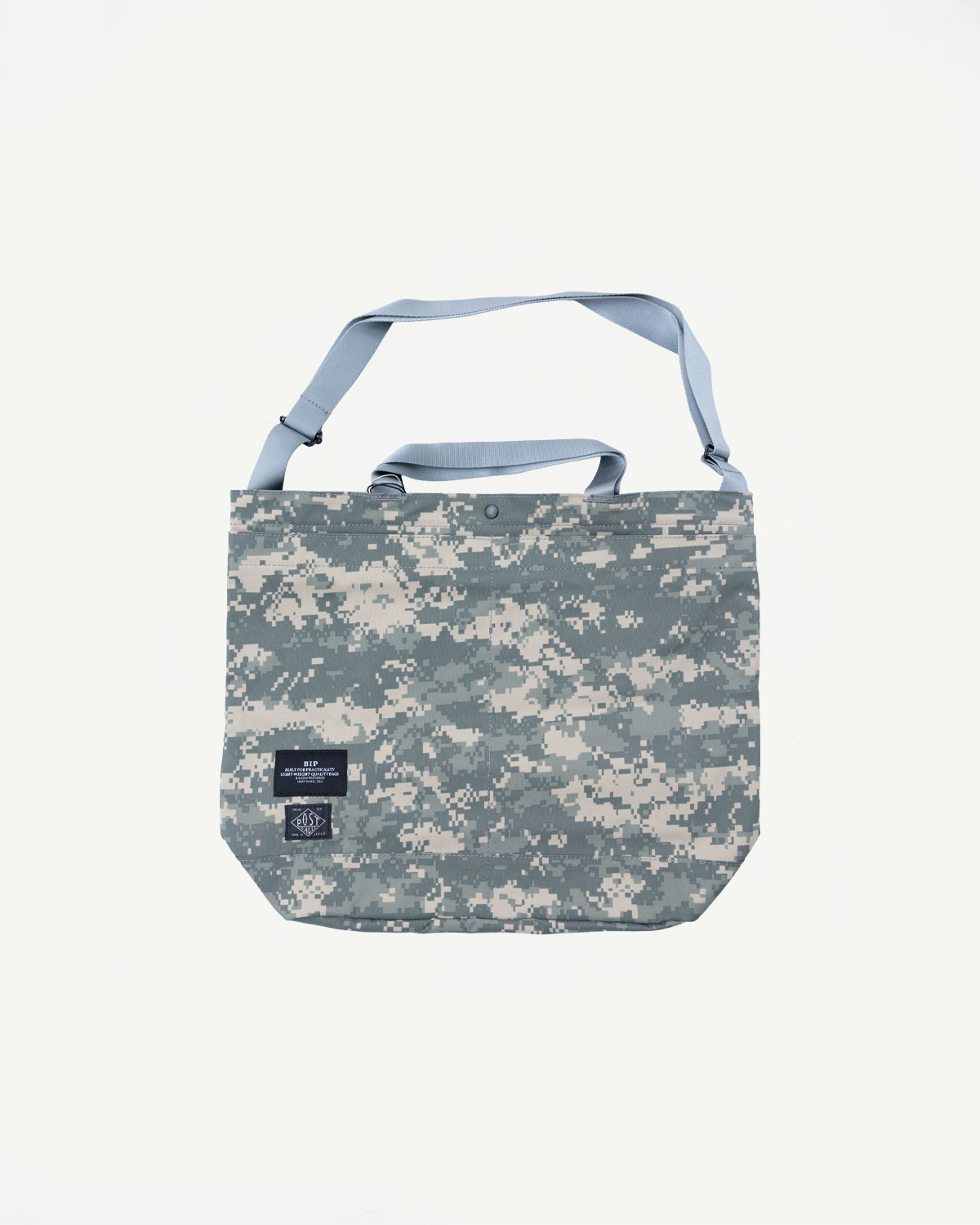 Front view flat lay of digital camo tote bag with Gore-Tex fabric and blue straps, Dant.