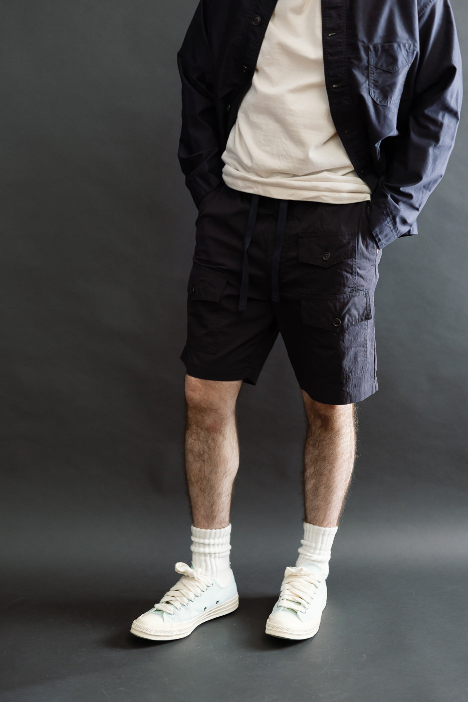 Front view, full body shot of navy town and country shorts in 60/40 twill on male model, 5'9