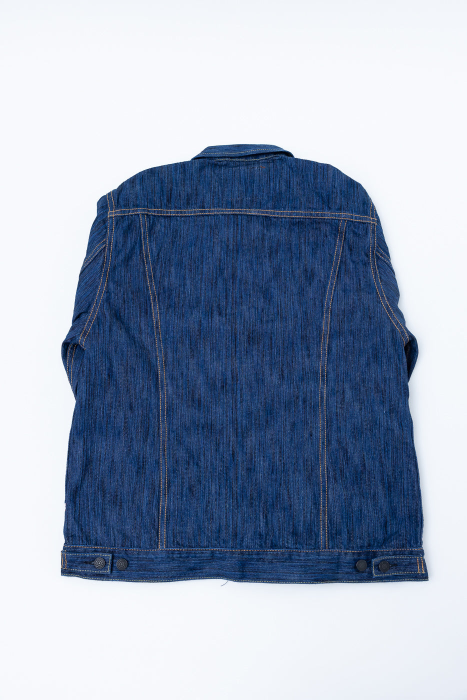 Back view of the 6226-L - 14.5oz Light Waterfall Selvedge Type III Jacket - Indigo, showcasing yoke seam, vertical panel stitching, and adjustable waist tabs, highlighting its textured Japanese selvedge denim construction.