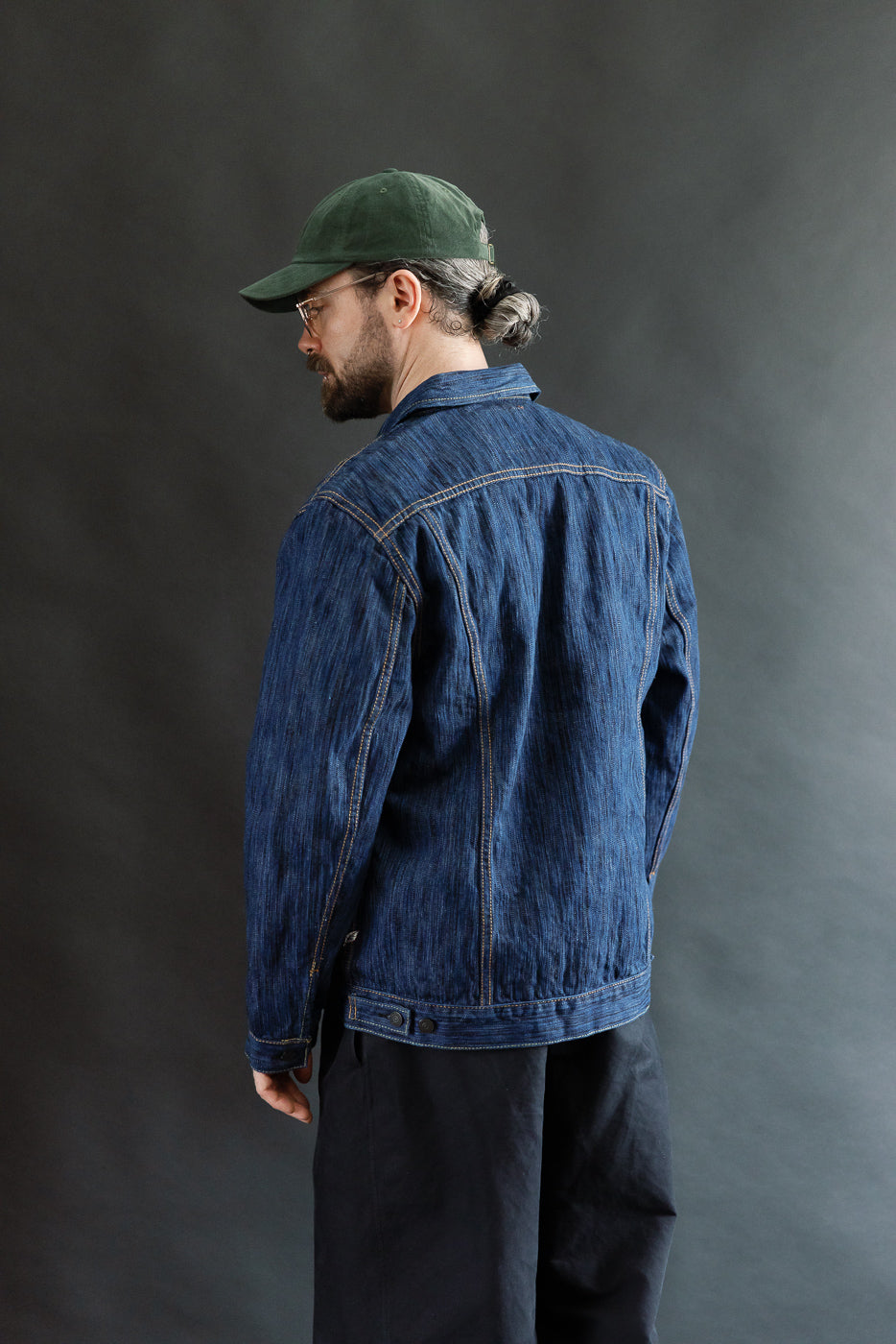 The 6226-L - 14.5oz Light Waterfall Selvedge Type III Jacket - Indigo features textured Japanese selvedge denim with contrast stitching and classic Type-III details, worn by a model in styled casual attire.