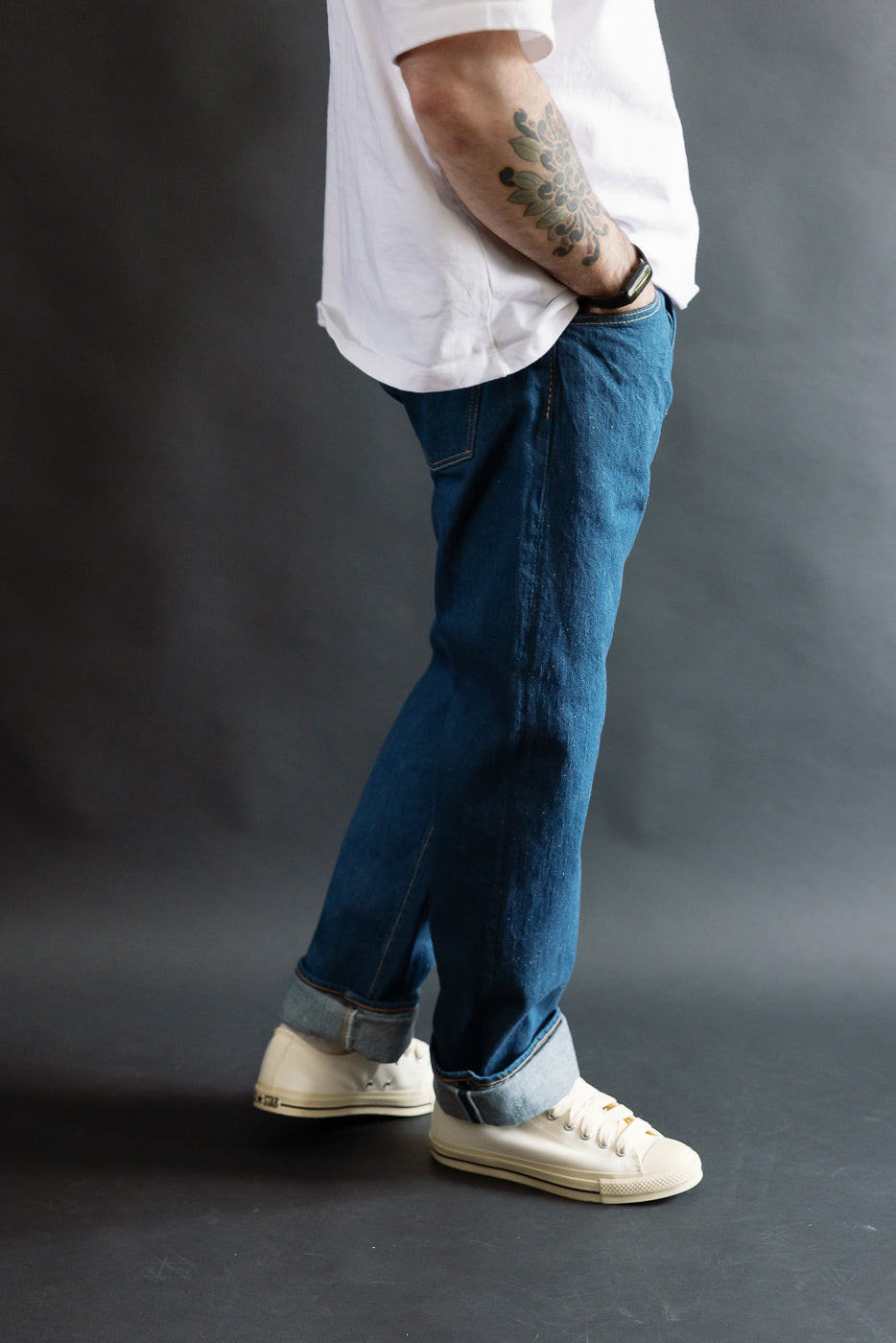 Side view of Pure Blue Japan GRE-003 14oz greencast indigo selvedge jeans on male model, 5'9