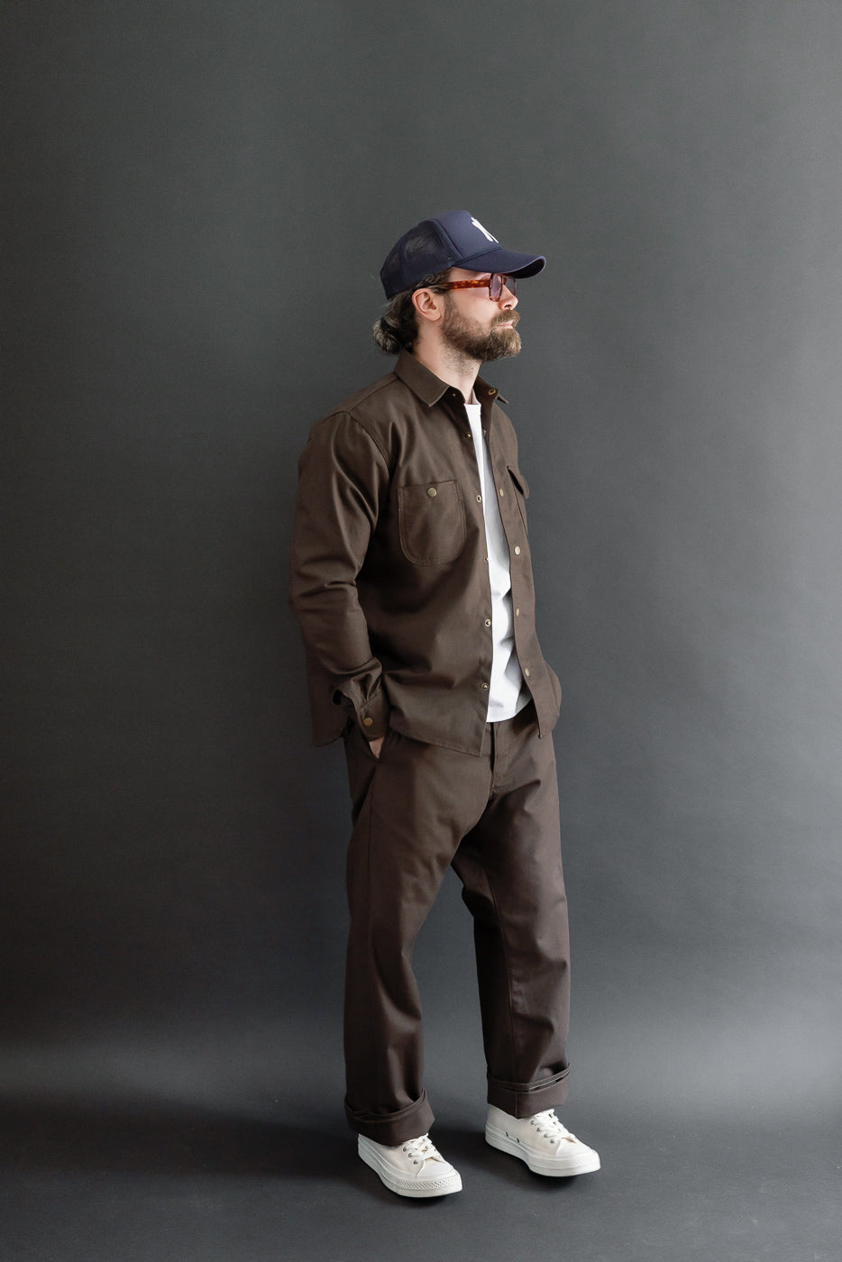 Full body side view of a male model, 5'9