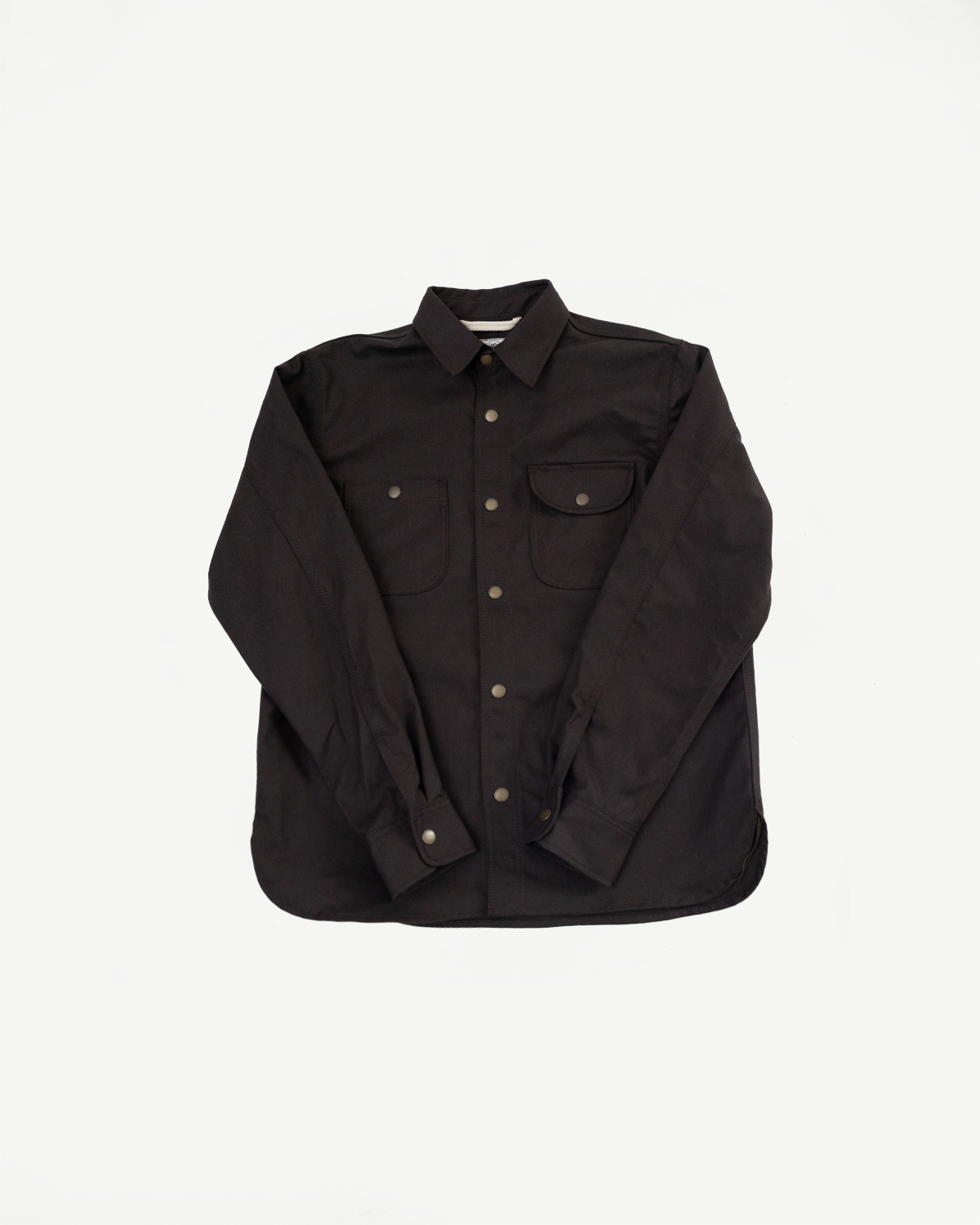 Front view flat lay of a black long-sleeve button-down shirt with dual chest pockets.