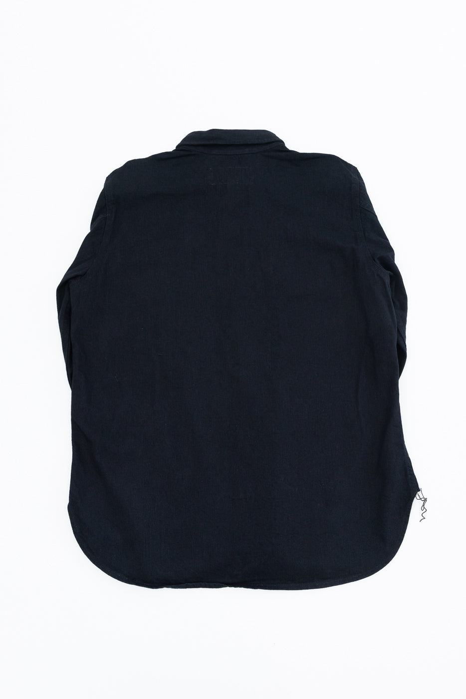 Back view of black shirt, flat lay, showcasing collar and hem details