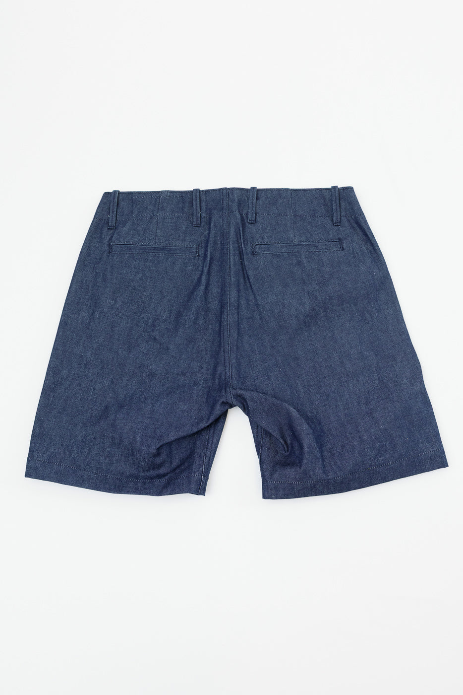 Back view of men's denim shorts, showing rear pockets and hem detail on flat lay