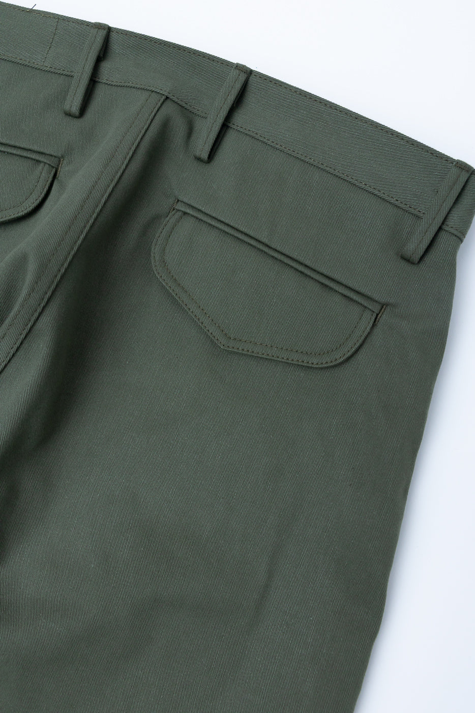Close-up of back of olive green officer high trouser, showing rear pocket and belt loops.